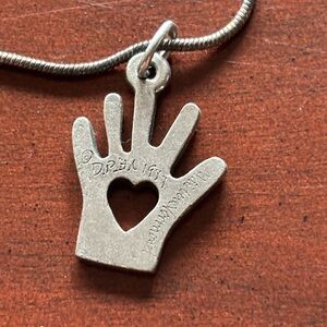 Silver Heart in Hand Pendant Necklace